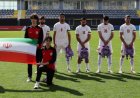 Iranian footballers carry schoolbags to show solidarity with the slain girls