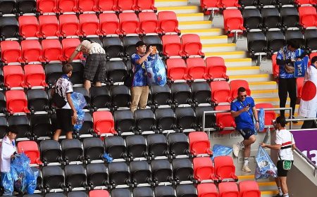 ‘This is our culture’: Japan fans tidy up World Cup stadium after match