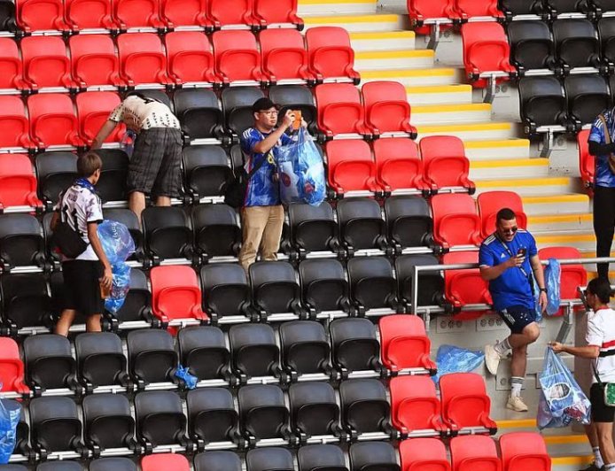 ‘This is our culture’: Japan fans tidy up World Cup stadium after match