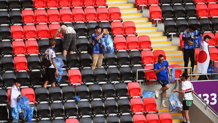 ‘This is our culture’: Japan fans tidy up World Cup stadium after match